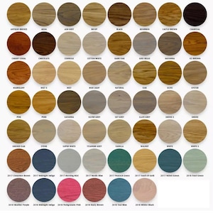 May include: A colour chart displaying a range of wood stain shades. The chart includes colours such as Antique Bronze, Black, and Walnut, alongside various shades of blue, green, and pink. Each colour is labelled with its name.