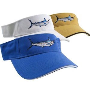 May include: Three visors with a marlin fish embroidered on the front. The visors are white, yellow, and blue.