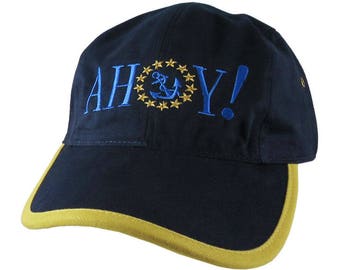 Ahoy! American Yacht Anchor Greeting Embroidery on Polo Style 5 Panel Adjustable Mango and Navy Unstructured Cap for the Boating Enthusiast