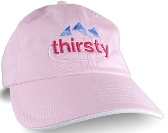 A Thirsty Evian Parody Humorous Embroidery Design on an Adjustable Light Pink and White Unstructured Baseball Cap Dad Hat Style