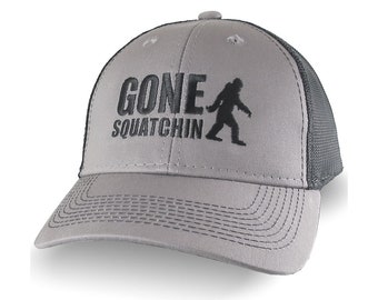 Gone Squatchin Humorous Sasquatch Bigfoot Silhouette Black Embroidery on an Adjustable Grey and Black Truckers Style Ball Cap