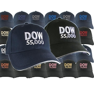 May include: A collection of baseball caps in various colors, including navy blue and black, featuring embroidered text. The caps display the text DOW 50,000 or DOW 55,000 in white, red, gold, or pink lettering on the front panels of each hat.