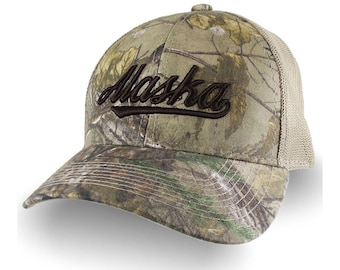 Alaska Brown 3D Puff Raised Embroidery Design on an Adjustable Realtree Camo Structured Classic Trucker Mesh Cap