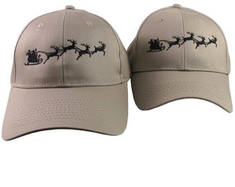 A Pair of Holidays Christmas Santa Sleigh Embroidery Designs on 2 Beige Adjustable Structured Baseball Caps for Adult + for Child Age 6-12