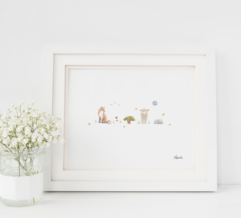 May include: A white framed print with a watercolor illustration of a fox, a sheep, a tree, a red flower, and a blue moon. The print is signed "Habibi."