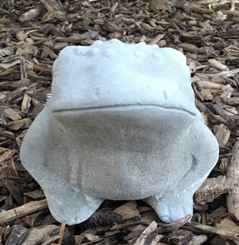 concrete frog statue