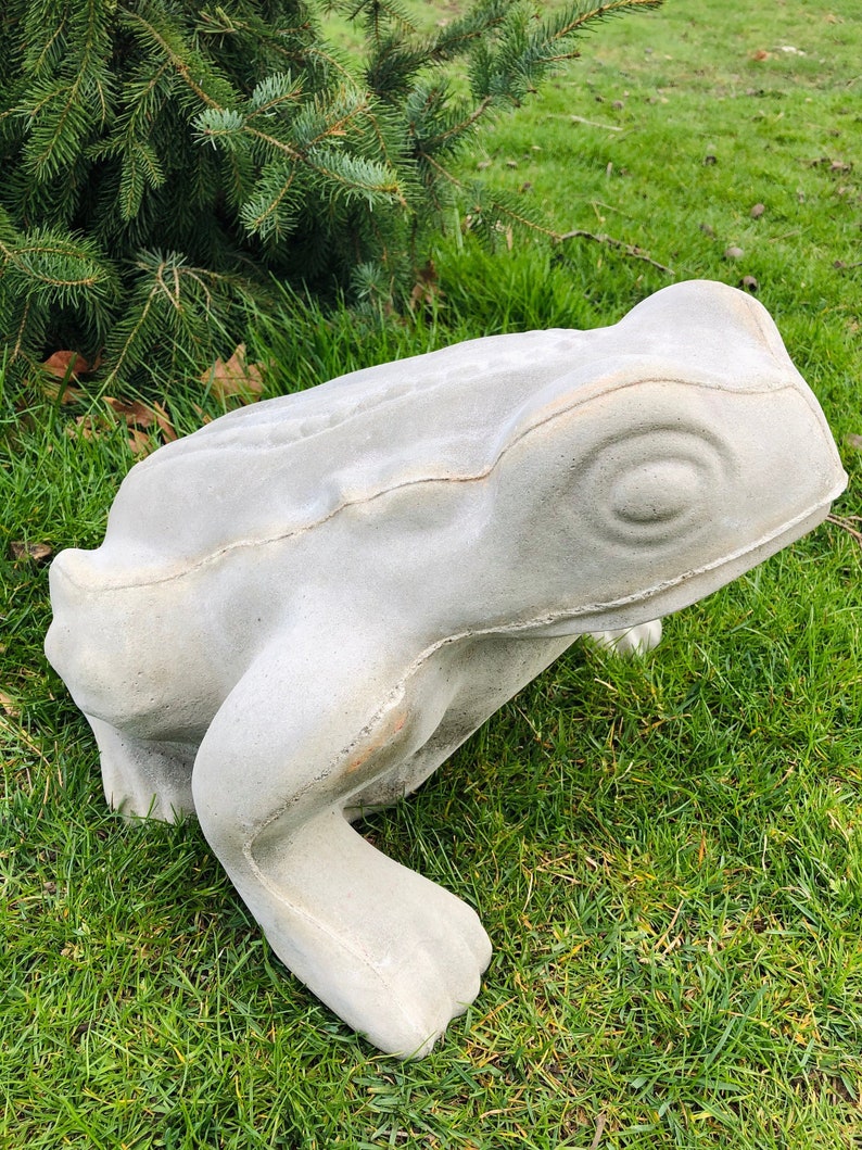 concrete frog statue