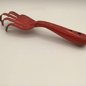 Vintage metal hand rake-fork-cultivator, vintage gardening tool, red hand tool, metal, rusty and primitive