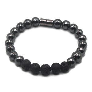 May include: A black beaded bracelet featuring a mix of smooth, glossy hematite beads and textured lava rock beads. The bracelet is secured with a magnetic clasp. The beads are approximately 8mm in diameter.