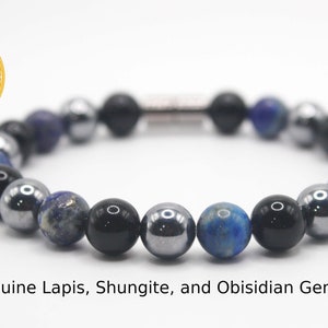May include: An Auras by Osiris bracelet made with genuine lapis lazuli, shungite, and obsidian gemstones. The bracelet has a silver clasp.