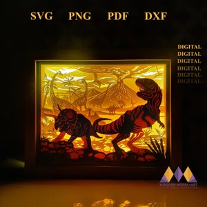 May include: A digital download of a dinosaur-themed light-up shadow box design. The design features a T-Rex, a Triceratops, and a volcano. The design is available in SVG, PNG, PDF, and DXF formats.