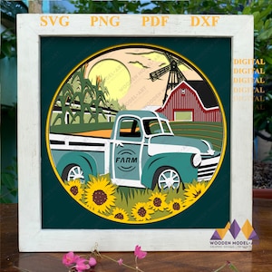 May include: A blue pickup truck with the word "FARM" on the side, parked in front of a red barn with a windmill. The truck is surrounded by sunflowers and corn stalks. The scene is set against a sunset sky.
