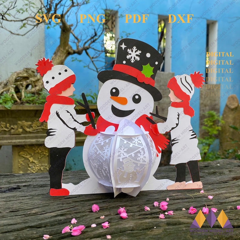 May include: A white snowman with a red hat and scarf, holding a white, round, decorative lantern. Two children, one wearing a red hat and the other a white hat, are standing on either side of the snowman.