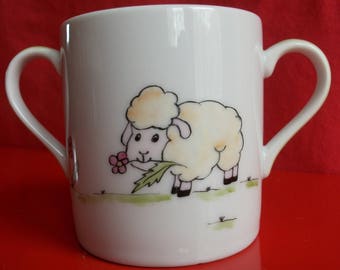 Custom decorated tumbler "Sheep holding a flower", Limoges porcelain timpani, hand-painted timpani, two-handled glass