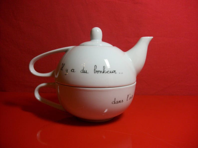 Selfish called teapot in Limoges porcelain decorated by hand with a Hedgehog on a swing