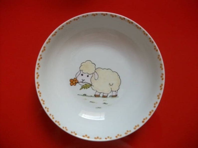 Limoges porcelain children/'s plate decorated with a Mouton carrying a flower round hollow plate painted by hand.