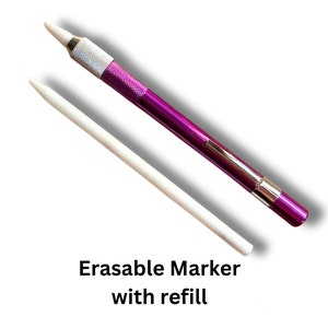 May include: A purple erasable marker with a white refill. The marker is made of metal and has a silver cap. The refill is a white stick.