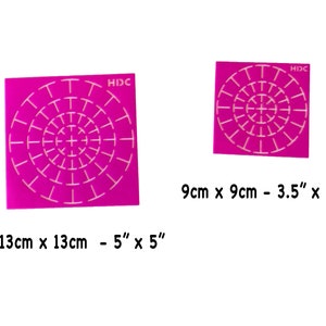 May include: Two pink plastic stencils with a circular pattern of white lines. The larger stencil is 5 inches by 5 inches and the smaller stencil is 3.5 inches by 3.5 inches.
