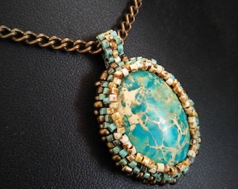 Turquoise Blue Jasper pendant necklace, stone set with needle-embroidered beads, on brass chain - Handmade, unique piece