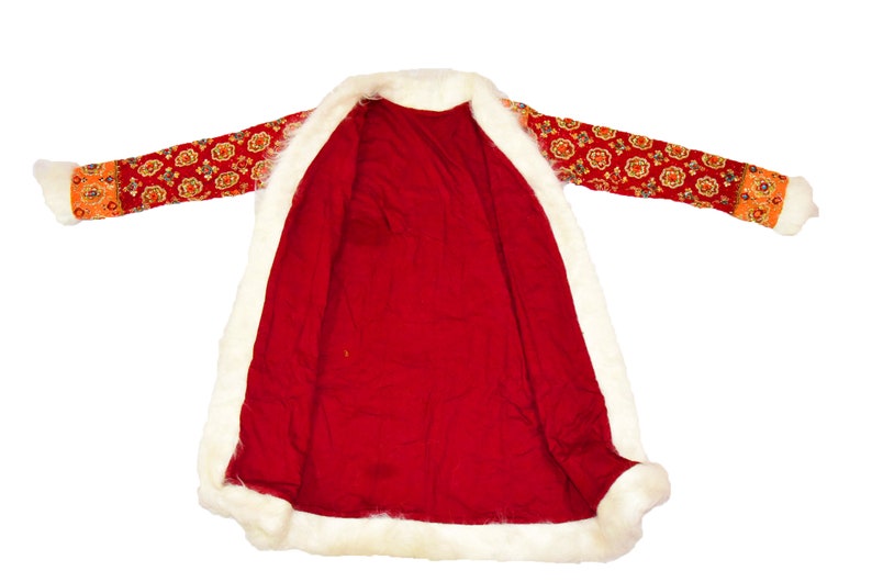 May include: A red coat with a white fur trim and a floral pattern on the sleeves. The coat is unbuttoned and the lining is visible.
