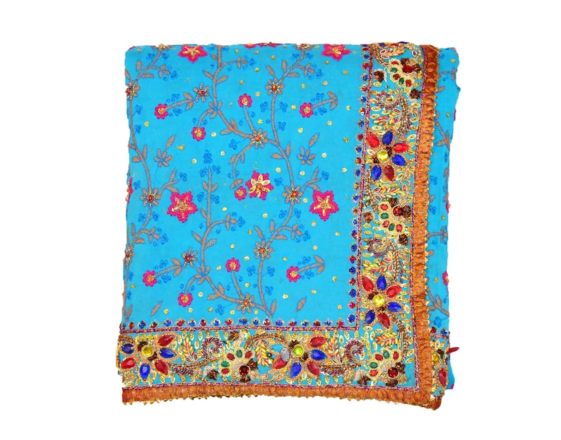 May include: A blue and gold embroidered sari with a floral pattern and jeweled trim.