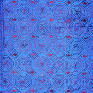 May include: Blue fabric with a repeating pattern of red concentric circles and diamonds.