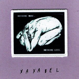 May include: A rectangular embroidered patch with a white border featuring a black background and a white illustration of a figure curled in a fetal position. The text "NOTHING MORE." appears in the top left and "NOTHING LESS." in the bottom right.