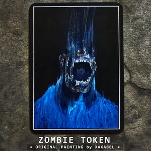 May include: A rectangular card featuring a dark, vertical painting of a screaming figure with a blue, textured body and an elongated head against a black background. The text ZOMBIE TOKEN and ORIGINAL PAINTING by XAXABEL is printed at the bottom.