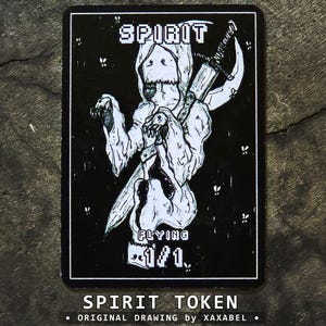 May include: A rectangular black and white game card featuring a hooded figure holding a large sword. The text reads SPIRIT at the top, FLYING in the middle, and 1/1 at the bottom. The card has a white border and small white speckles across the black background.
