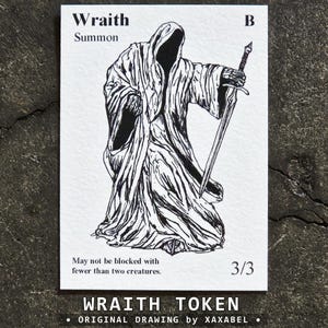 May include: A rectangular white game card featuring a black ink illustration of a hooded wraith figure holding a sword. The text reads Wraith, Summon, B, 3/3, and May not be blocked with fewer than two creatures. The card has a textured paper appearance.