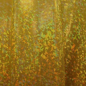 May include: A close-up of iridescent gold fabric with a textured, shimmering surface.