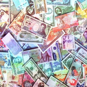 May include: A close-up image of a variety of colorful paper money from different countries. The bills are arranged in a random pattern, with some overlapping. The image includes bills from Japan, South Korea, Argentina, and other countries. The bills are in various denominations, including 1000 yen, 5000 won, 5000 pesos, and 100 dollars.