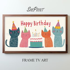 以下が含まれることがあります： パーティーハットをかぶった4匹の漫画の猫、バースデーケーキ、そして「Happy Birthday」の文字が描かれた額入りのプリント。猫は青、ピンク、オレンジの色合いです。プリントには「SHEPRINT」と「FRAME TV ART」と書かれています。