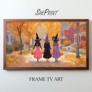 Könnte beinhalten: Gerahmter Druck von drei jungen Hexen, die eine Straße entlanggehen und Kürbislaternen halten. Das Kunstwerk zeigt eine warme Farbpalette aus Orange, Rosa und Lila mit dem Text "SHEPRINT" und "FRAME TV ART".