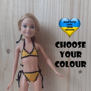 May include: A doll in a handmade yellow and black crochet bikini. The doll is positioned against a light wood backdrop. The image includes the text "CHOOSE YOUR COLOUR" and "MADE WITH LOVE FROM UKRAINE".