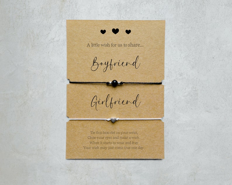 May include: Two friendship bracelets with a card that reads "A little wish for us to share... Boyfriend Girlfriend Tie this bracelet on your wrist, Close your eyes and make a wish. When it starts to wear and fray Your wish may just come true one day."