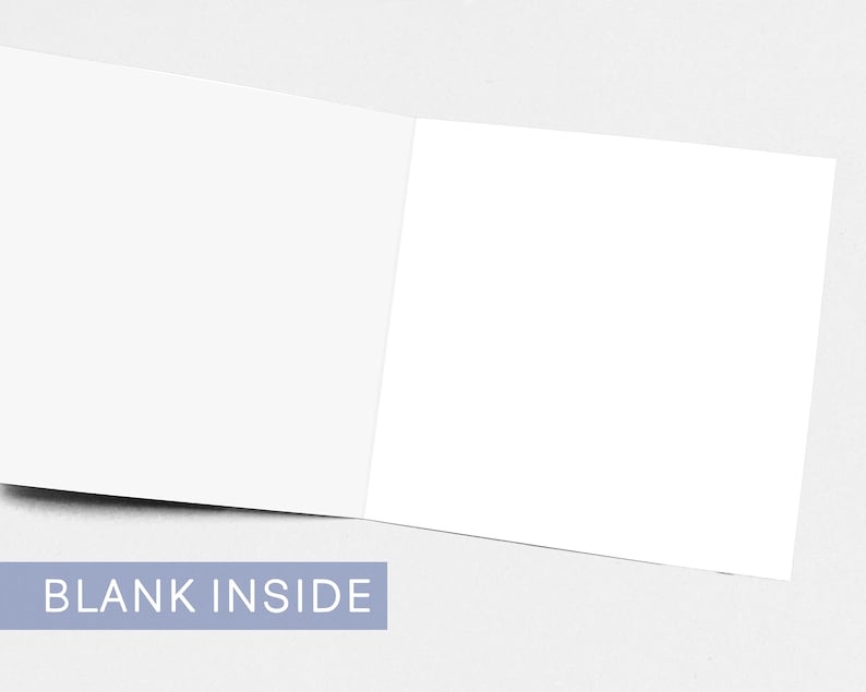 May include: An open, blank greeting card with a white interior. The card is displayed on a light gray surface. The text "BLANK INSIDE" is printed in white on a light blue rectangular label.