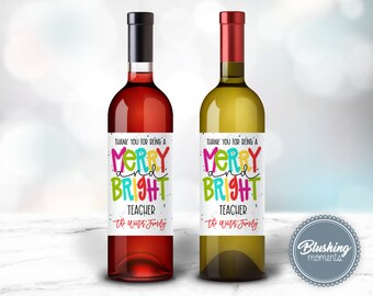 May include: Two wine bottles with labels that say "Thank you for being a Merry and Bright Teacher" with the text "The Winter Family" at the bottom. The labels are white with colorful text and a red and green background.