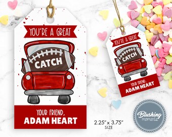 May include: Red and white printable gift tag with a red pickup truck carrying a football. The text on the tag reads "You're a great catch, your friend, Adam Heart". The tag measures 2.25 inches by 3.75 inches.