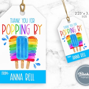 May include: Thank you for popping by! A colorful rainbow popsicle with blue ice cream on a white tag with blue text that says "Thank you for popping by!" and "From: Anna Bell". The tag is 2.25 inches by 3.75 inches.