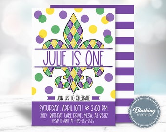May include: A purple, green, and yellow watercolor fleur-de-lis with the text "JULIE IS ONE" on a white background with yellow, green, and purple polka dots. The text below the fleur-de-lis reads "JOIN US TO CELEBRATE" and includes the date, time, address, and RSVP information.