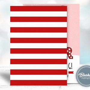 May include: Red and white striped card with the text "Merry Christmas!" in red glitter letters. The card is decorated with a red glitter snowflake and a white glitter snowflake. The card is from "Blushing Moments".