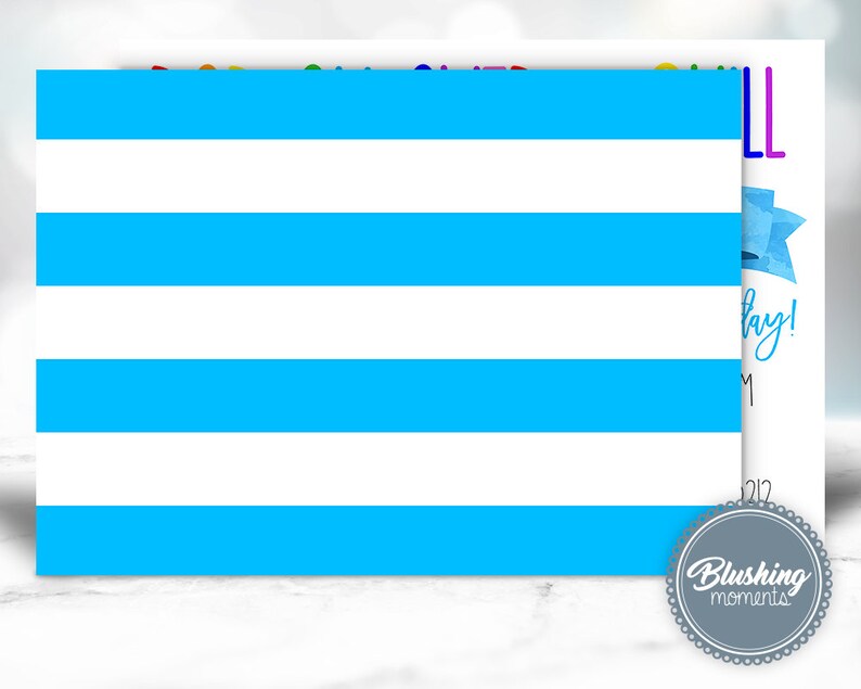 May include: A white card with horizontal blue stripes. The card has text that reads "Happy Birthday!" and "Blushing Moments" in a circular logo. A blue bow is also visible.