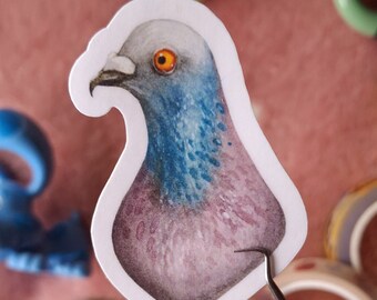 May include: A sticker featuring a watercolour illustration of a pigeon with a pink and blue body and an orange eye. The sticker is on a white background.