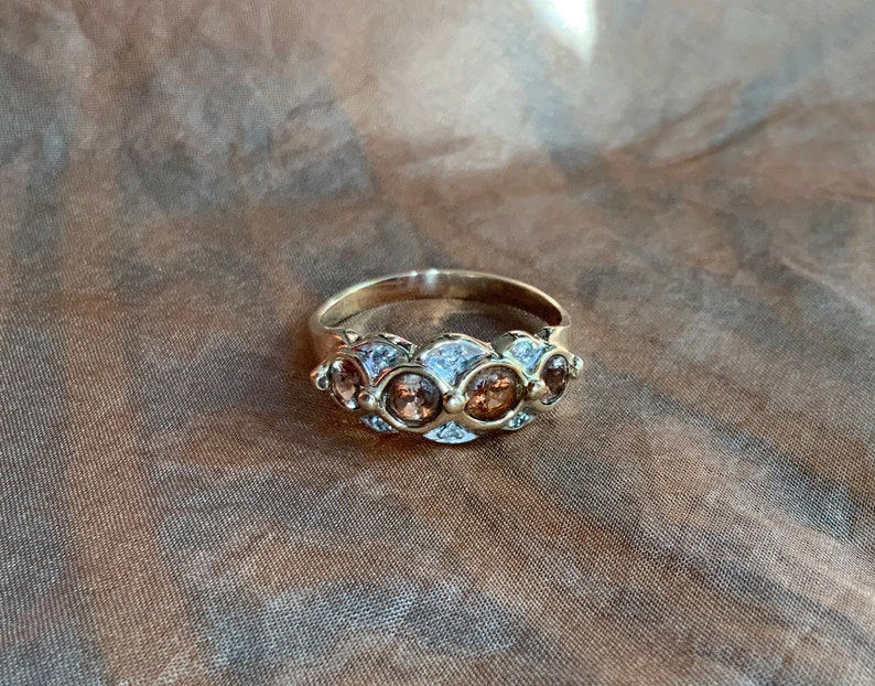 Diamond and andalusite dress ring in 9 ct gold..