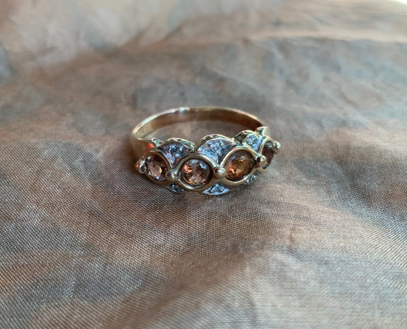 Diamond and andalusite dress ring in 9 ct gold..