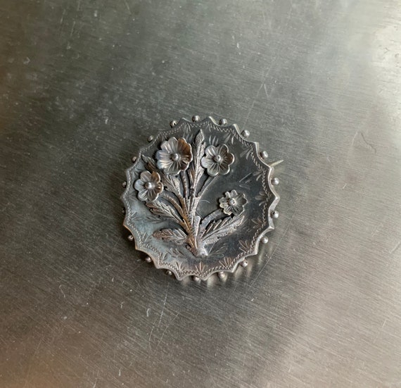 Aesthetic movement silver brooch.