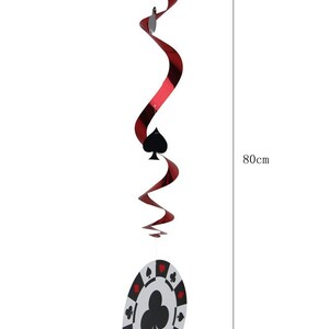 May include: A casino-themed hanging decoration with a red and black spiral design, a black spade symbol, and a poker chip. The poker chip is 20 cm in diameter and the total length is 80 cm.
