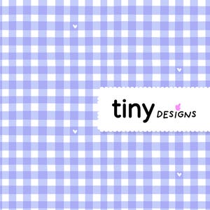 May include: A seamless pattern featuring a light purple and white gingham check design. Small white hearts are scattered across the background. The text "tiny designs" is displayed on a white, scalloped-edge banner.