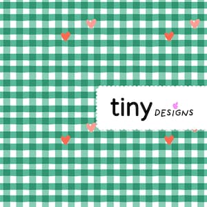 May include: A repeating pattern of green and white gingham checks with small, scattered coral-colored hearts. The design includes the text "tiny designs" in a white, scalloped-edged rectangle.